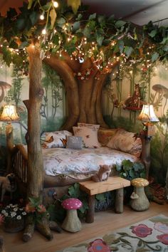 a bedroom decorated with fairy furniture and lights on the ceiling, trees in the background