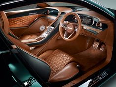 the interior of a car with brown leather and tan stitching on the dash board