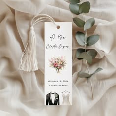 a white tag with an image of a tuxedo and flowers on it