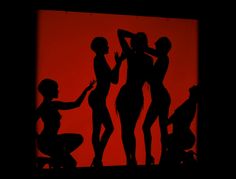 the silhouettes of three women are shown in front of a red background with black shadows