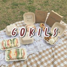 there is a picnic table with food on it and the words gokils written in large letters