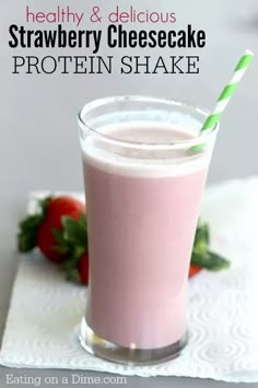 strawberry cheesecake protein shake in a glass with strawberries on the side and text overlay that reads healthy & delicious strawberry cheesecake protein shake