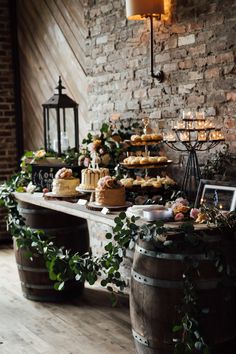 a table topped with lots of cakes and desserts