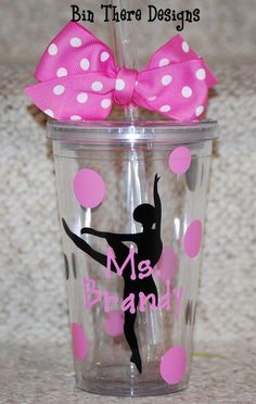 a cup with a pink bow on it