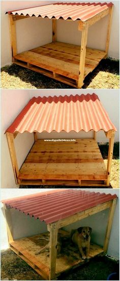 the dog house is made out of pallet wood and has a roof over it