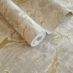 an image of a gold and white wallpaper with marble pattern on it's surface