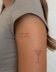 a woman with a small tattoo on her arm