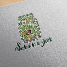 the logo for salad in a jar is shown on a white paper with green lettering