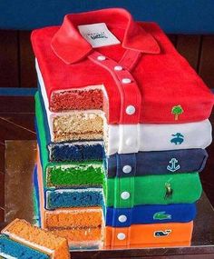 a cake made to look like polo shirts stacked on top of each other in different colors