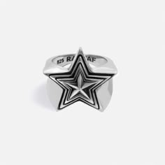 The iconic RAFTAF piece. Wear the star that brightens your dreams. MATERIAL  Made of 925 sterling silver, solid silver FINISHING (OPTIONAL) 925 Sterling Silver RING SIZE (OPTIONAL) Small: 6.5 US (Diameter: 16.8 mm) Medium: 8.5 US (Diameter: 18.4 mm) Large: 9 US (Diameter: 19.1 mm) X Large: 11.5 US (Diameter: 21 mm) WEIGHT 14 g PACKAGING You are in the right place to make your special gifts for him or her. All orders are nicely packaged ready to gift in cool RAFTAF boxes. DESIGN & CRAFTMANSHIP All RAFTAF pieces are designed by our talented and ambitious design team. Production process is carried out by experienced craftsmen in the Istanbul Grand Bazaar, which is famous for jewelry production for centuries. Please note that slight changes in colour and traces of the artisanal process are par Star Diamond Ring For Men, Tupac Star Ring, Sirius Star Ring, Star Jewelry Ring, Star Gifts For Men, Silver Star Ring, Boxes Design, Special Gifts For Him, Handcrafted Silver Jewelry