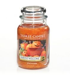 yankee candle jar filled with harvest welcome pumpkins