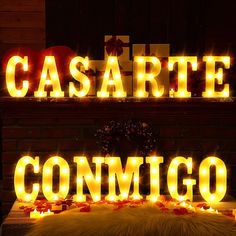 the word cesare is lit up with candles