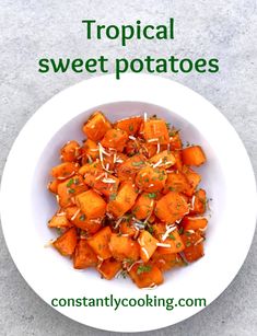 a white bowl filled with carrots on top of a table