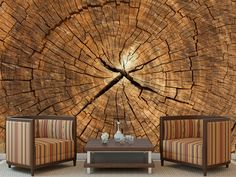 two chairs sitting next to each other in front of a tree stump wallpaper mural