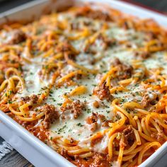 a casserole dish filled with meat and cheese