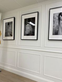 three black and white photographs hanging on the wall