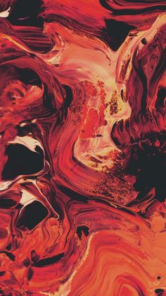 an abstract painting with red, orange and black colors on it's surface that looks like fluid paint