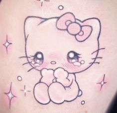 a close up of a person's stomach with a hello kitty tattoo on it