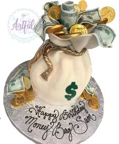 a money bag is on top of a cake with the words happy birthday money bag