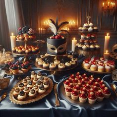 a table topped with lots of cakes and cupcakes