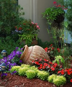 a garden filled with lots of flowers and plants