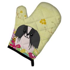 a oven mitt with a black dog on it