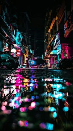 a city street filled with lots of colorful umbrellas