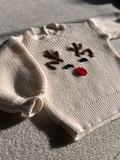 ✿ Welcome to MinimaKids ✿ How to order: 1. Please select the sweater color from the options. 2. Please select the size from the options. 3. Then, add to cart to complete your order. Looking for the perfect Christmas gift for your little one? Look no further! This adorable baby sweater combines festive cheer and cozy warmth in one delightful package. Featuring a charming design, this sweater is an ideal choice for those seeking a unique and thoughtful holiday gift. Our newborn baby sweaters are also a popular choice for baby shower gifts, adding both practicality and sentimental value. Crafted as a knitted baby outfit, this sweater is gentle on your baby's delicate skin, thanks to its soft texture. Plus, it comes with a GOTS (Global Organic Textile Standard) certificate, ensuring it's made Christmas Baby Clothes, Baby Christmas Sweater, My First Christmas Outfit, First Christmas Outfit, Baby Boy Christmas Outfit, Baby's 1st Christmas, Boys Christmas Outfits, Baby Boy Christmas, Pull Bebe