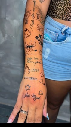 a woman's arm with tattoos on it, and the words written in different languages