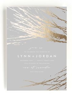 an elegant wedding card with gold foil on the front and silver background, featuring branches