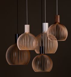 four wooden lights hanging from the ceiling