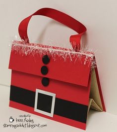 an origami christmas bag with santa's hat on the front and bottom