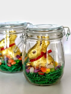 two glass jars filled with candy and gold foil bunny