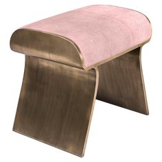 a pink bench sitting on top of a metal frame