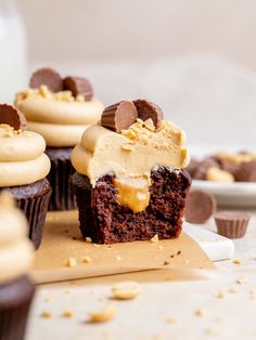 chocolate cupcakes with peanut butter frosting and chopped peanuts