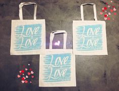 three bags with the words love on them