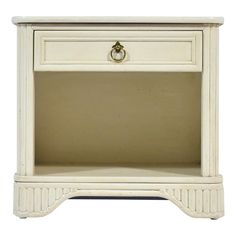 a white nightstand with an open drawer on the bottom and one drawer at the top