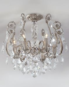 a crystal chandelier hanging from the ceiling