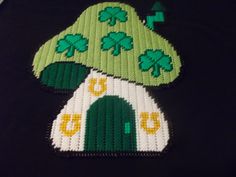 a close up of a piece of art made out of lego blocks with shamrocks on it