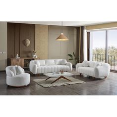 a living room filled with white furniture next to a sliding glass door and wooden floors