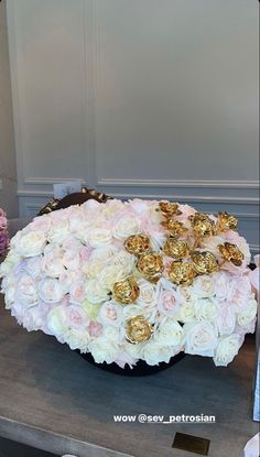 a large bouquet of white and pink roses