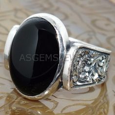 NATURAL BLACK ONYX GEM WEDDING BAND RING PERFECT PROMISE GIFT FOR HIM MATERIAL-925 Sterling Silver GEMSTONE- Black Onyx GEMSTONE COLOR- Black GEMSTONE SHAPE- Oval Shape GENDER- Male,Female BIRTHSTONE- December JEWELRY TYPE- Ring HEALING PROPERTIES OF GEMSTONE- A powerful protection stone, Black Onyx absorbs and transforms negative energy, and helps to prevent the drain of personal energy. Black Onyx aids the development of emotional and physical strength and stamina, especially when support is n Victorian Carved Wedding Rings, Ornate Black Sterling Silver Rings, Traditional Oval Signet Ring For Wedding, Oval Engraved Carved Ring For Wedding, Classic Carved Signet Ring For Wedding, Traditional Carved Rings For Wedding, Engraved Oval Ring For Wedding, Victorian Carved Ring For Anniversary, Ornate Black Oval Ring