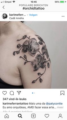 a woman's shoulder with flowers on it