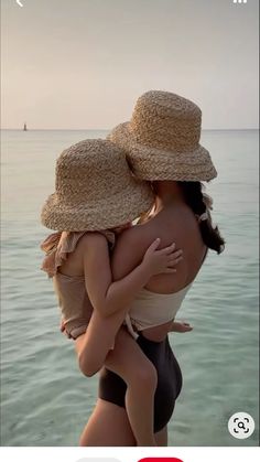 two women in bathing suits and hats hugging each other on the beach with text overlay