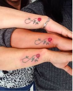 two women with matching tattoos on their arms