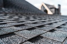 the roof of a house that has been gutted with shingles and is covered in snow