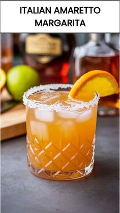 a close up of a drink in a glass with an orange slice on the rim