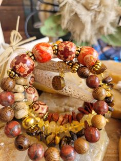 Boho/Hippie Style Bracelet. Made with Gold Memory Wire, Multi Colored Glass Beads ,Natural Colored Beads, Citrine Chip Beads, Gold Antiqued Spacer Beads, Red Jasper Chip Beads, Multi Colored Orange/Jasper Beads with Flower Design, Tiger Eye Chip Beads, Golden Tree Charm on one end Wood Beads Jewelry, Maximalist Jewelry, Safety Pin Jewelry, Boho Style Bracelets, Golden Tree, Whimsical Jewelry, Diy Jewelry Unique, Two Rivers, Boho Hippie Style