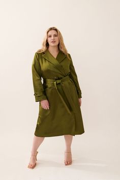 The Caterina Stretch Satin Coat is stunning, both inside and out. Beautiful, relaxed trench shape designed to be worn open or closed. Crafted of rich Italian stretch satin and lined in printed stretch silk charmeuse, the Caterina moves when you do. This is your ‘go-to’ piece; worn over jeans or out to the Oscars, either way, we've got you covered. Product Information: Italian Stretch Satin exterior – 48% Acetate, 45% Nylon, 7% Elastane. Silk Charmeuse Lining – 91% Silk, 9% Lycra. Buttons at waist, tie belt. Dry clean only. Model is 5’7” and wearing size 14. Satin Coat, The Oscars, Leaf Green, Wrap Coat, Women's Wear, Made Clothing, Silk Charmeuse, Stretch Satin, Pant Shirt