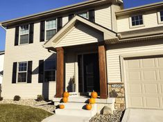 a house with white siding and brown trim